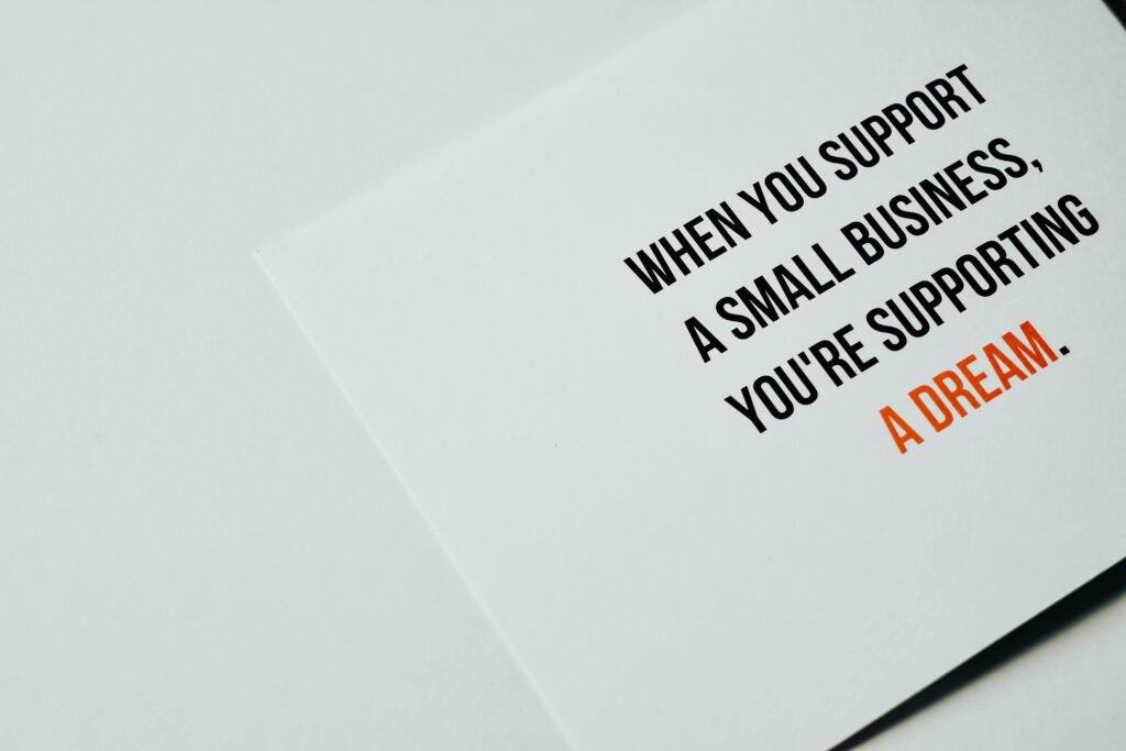 Motivational text promoting support for small businesses with a clean white background.